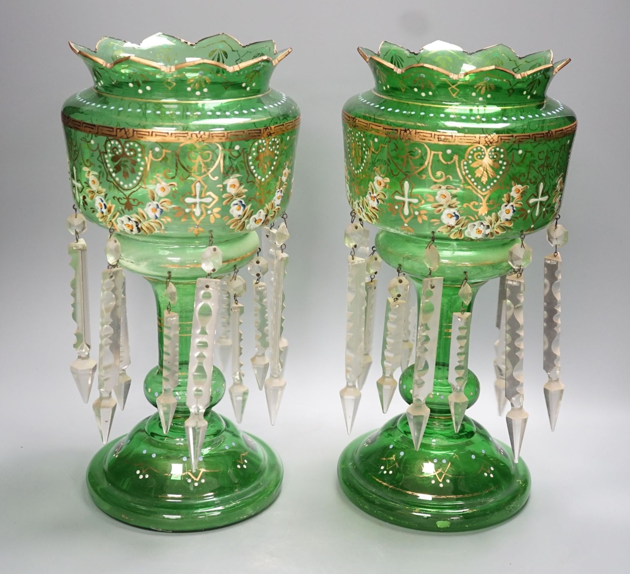 A pair of late 19th century green glass enamel lustres - 37cm high